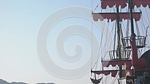 Ship masts with turkish flag. Sea bay and mountains.