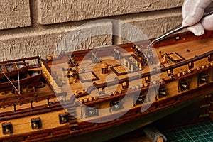 Ship model building in progress. Assembly of ship model from wood