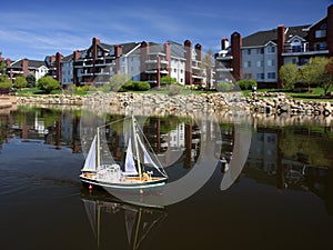 Ship model with sails on the water