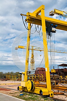 Ship and monumental crane in the shipyard