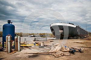 Ship and monumental crane in the shipyard