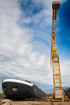 Ship and monumental crane in the shipyard