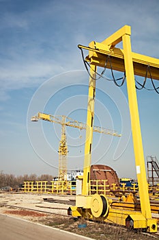 Ship and monumental crane in the shipyard
