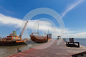 Ship and monumental crane in the shipyard.