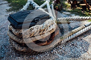 The ship is moored to a dock ladder rope chain