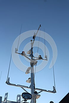 a ship navigation tool against a bright blue sky background