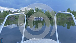 Ship Nose Front View boat at sea. view from motorboat. Elegant modern motor boat is at the dock in the bay river summer