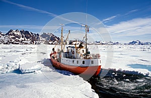 Ship in pack ice in Greenland photo