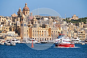 The ship passes the bay along the Birgu coast, Malta.