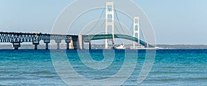 Ship passes under the Mackinac Bridge in Michigan