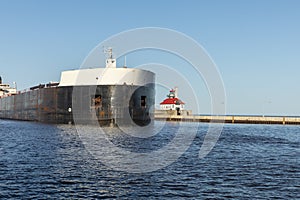 A Ship Passing A Lighthouse