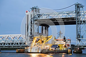 Ship passing under bascule bridge