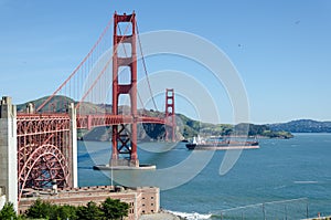 Ship passing under the Golden Gate Bridge photo