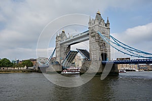 A ship passing underneath the Tower Bridge