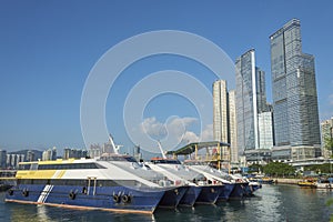 Ship and pier in Victoria harbor in Hong Kong city