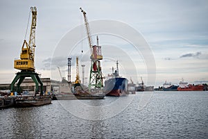 Ship and port cranes at repair area.