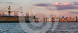 Ship in the Port with downtown city in background. Vancouver