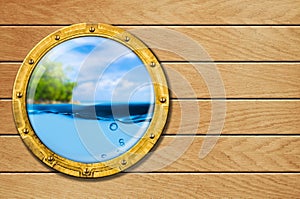 Ship porthole with tropical landscape