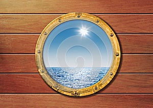 Ship porthole on wooden wall