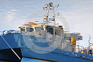 Ship reflected in water