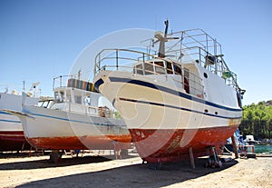 Ship repair on the ground in shipyard or harbor