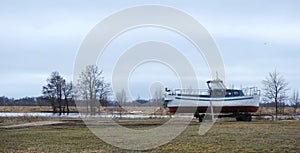 Ship on river coast, Lithuania