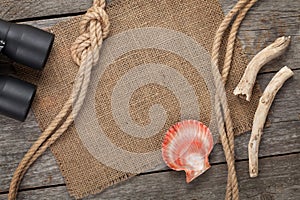 Ship rope with burlap on old wooden texture background