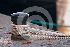 Ship rope tied to a harbor