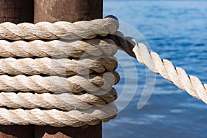 Ship rope tied to a pier.
