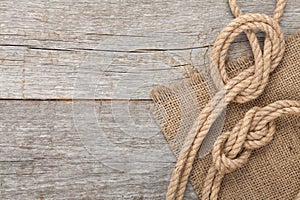 Ship rope on wooden texture background