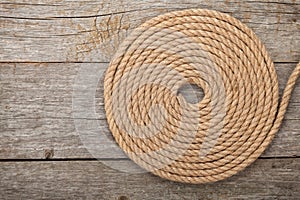 Ship rope on wooden texture background