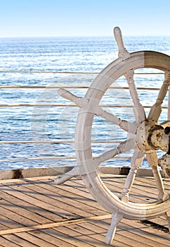 Ship rudder on blue background