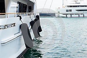 Ship`s bow and aquamarine water in the port of Syracuse, Sicily. Boat and sea, detail. Sailing vessel drops anchor