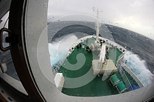 Ship`s Bow diving into a big splashing wave, Antarctica