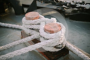 A ship's mooring rope tied to a dock,