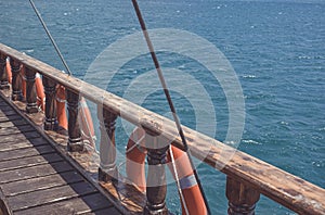 Ship`s old wooden side with lifebuoys