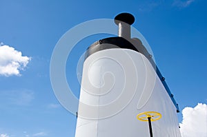 Ship`s smokestack against blue sky