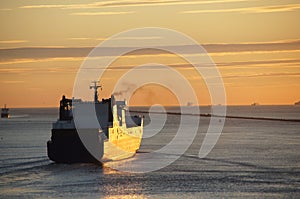 Ship sailing from Hoek van Holland at sunset