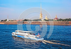The ship sails along the Neva River near the Peter and Paul Fortress