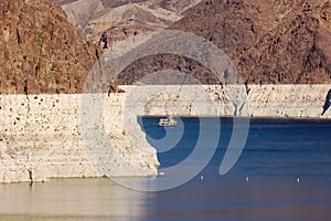 Ship sails on Lake Mead at Hoover Dam.