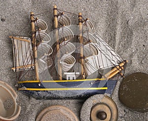 Ship and sails in the sand