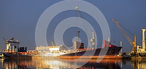 Ship in the sea port,port cranes unloading containers-panorama