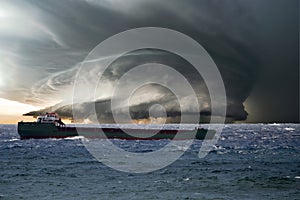 Ship in the tempest huricane cyclone photo