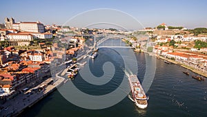 A ship with tourists near the bridges dom luis I, Porto, Portugal, 17 May 2017