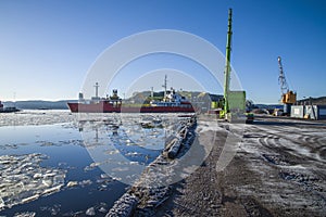 Ship turns around in the bay of halden harbor