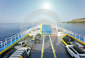 Ship vessel trasnfering cars to corfu from igoumenitsa in a summer morning