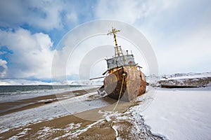 Ship washed ashore near Teriberka. Winter landscape. Russia