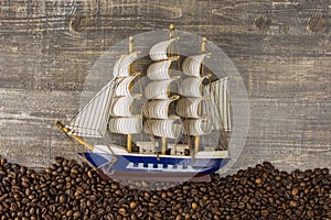 Ship waves from the coffee beans pictures beautiful background view the side wooden table. The concept of expand