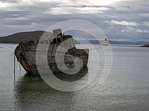 Ship wreck with cruise ship at Falkland Islands