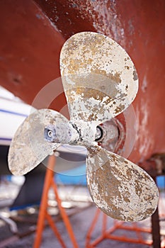 Ship yacht boat propeller restoring in shipyard sea